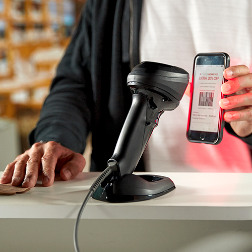 RFID-enabled scanner scanning barcode on customer phone screen