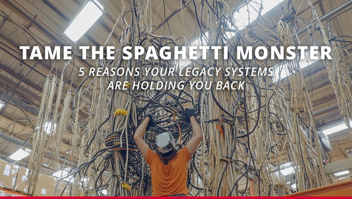 Warehouse worker in safety gear facing a massive tangled web of old cables, representing outdated technology, with bold text overlay reading “Tame the Spaghetti Monster – 5 Reasons Your Legacy Systems Are Holding You Back.”