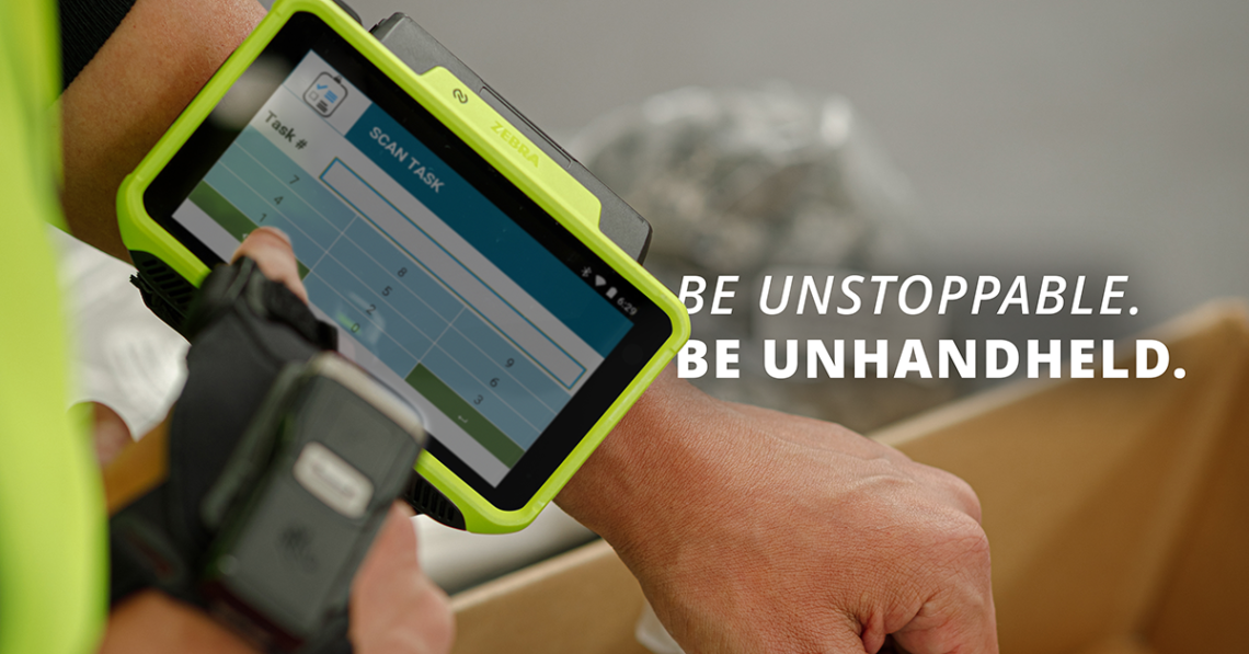 Warehouse worker using wearable computers with text overlay reading "Be unstoppable. Be unhandheld."