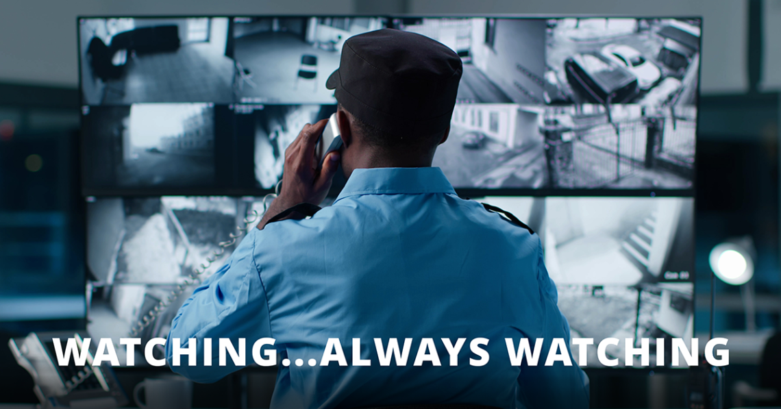 Man looking over surveillance screens as a metaphor for proactive monitoring in managed services